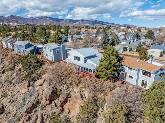 drone / aerial view with a residential view and a mountain view