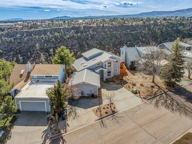 birds eye view of property featuring a mountain view