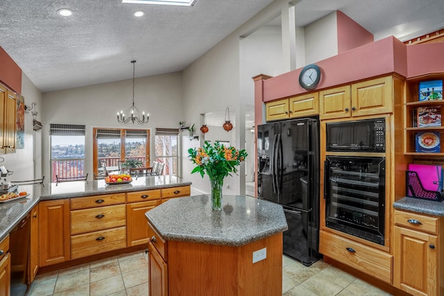 kitchen with beverage cooler, a peninsula, vaulted ceiling, a center island, and black appliances