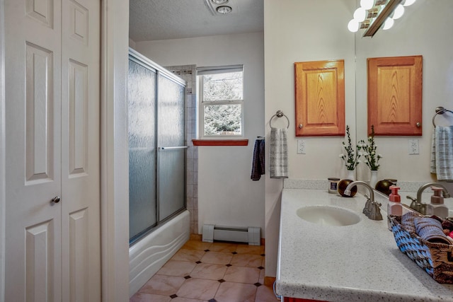 full bathroom featuring shower / bath combination with glass door, a closet, visible vents, baseboard heating, and vanity