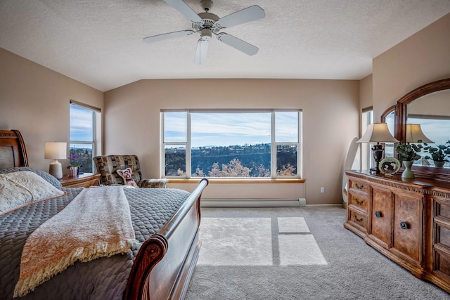 bedroom with light carpet, baseboards, vaulted ceiling, a textured ceiling, and a baseboard heating unit