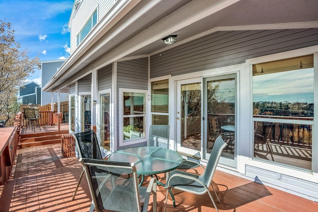 wooden deck with outdoor dining space