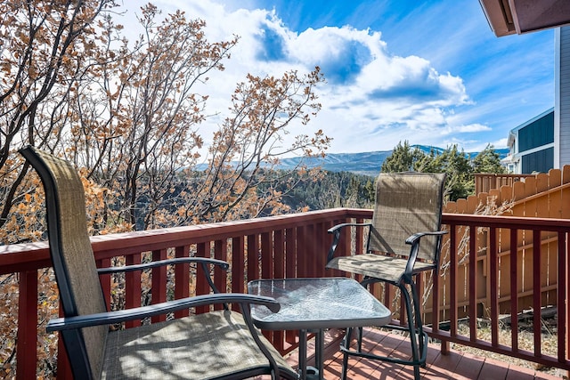 balcony featuring a deck with mountain view