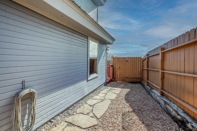 view of home's exterior with fence