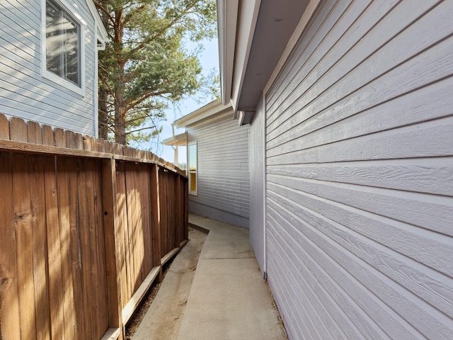 view of side of property with fence