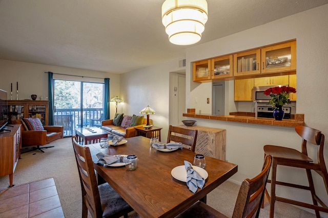 dining space with carpet flooring and visible vents