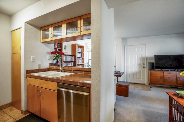 bar featuring dishwasher, light carpet, and a sink