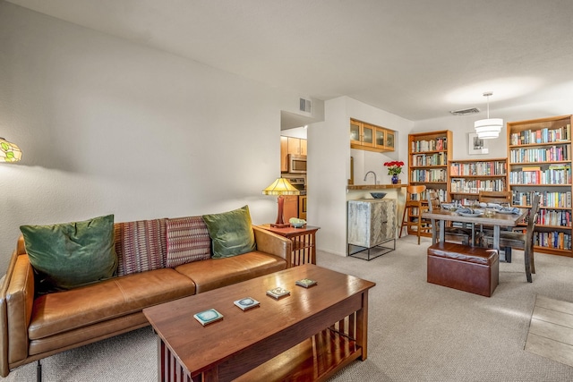 living area with carpet and visible vents