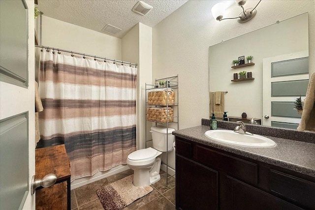 full bathroom featuring visible vents, a textured ceiling, toilet, and vanity