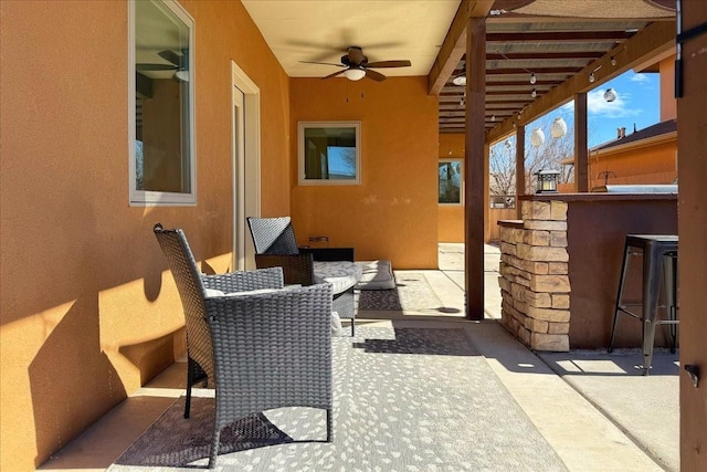 view of patio with a ceiling fan