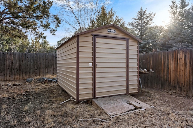 view of shed featuring a fenced backyard