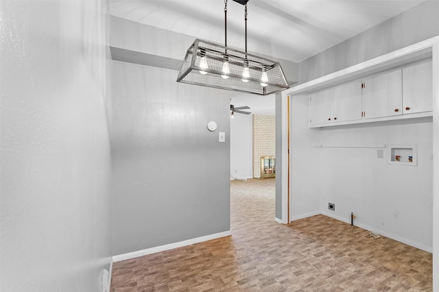 washroom featuring hookup for a gas dryer, hookup for an electric dryer, washer hookup, a ceiling fan, and cabinet space