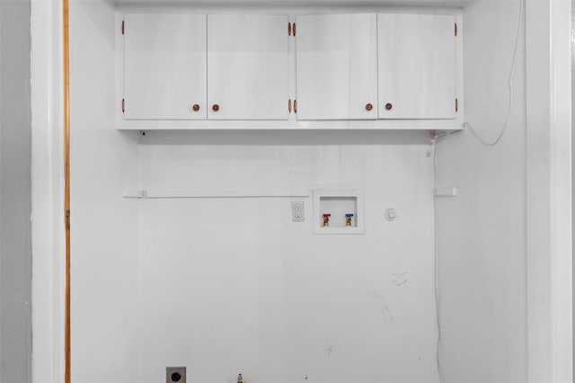 laundry room with washer hookup, hookup for an electric dryer, cabinet space, and hookup for a gas dryer