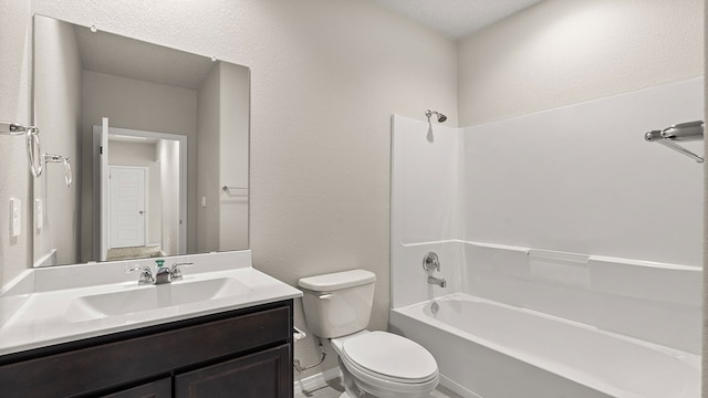 full bathroom featuring  shower combination, a textured wall, vanity, and toilet