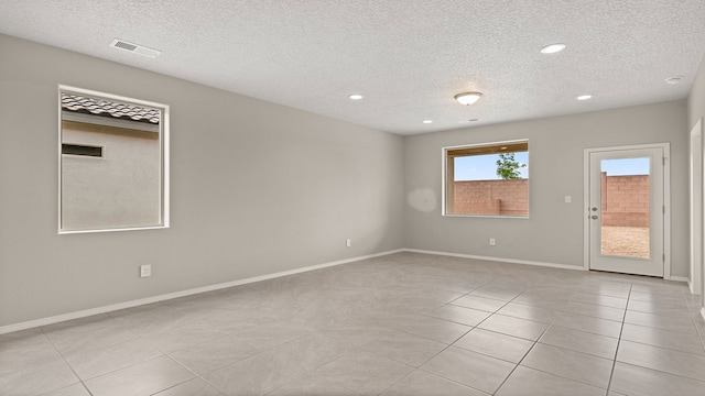 spare room with recessed lighting, visible vents, baseboards, and light tile patterned flooring