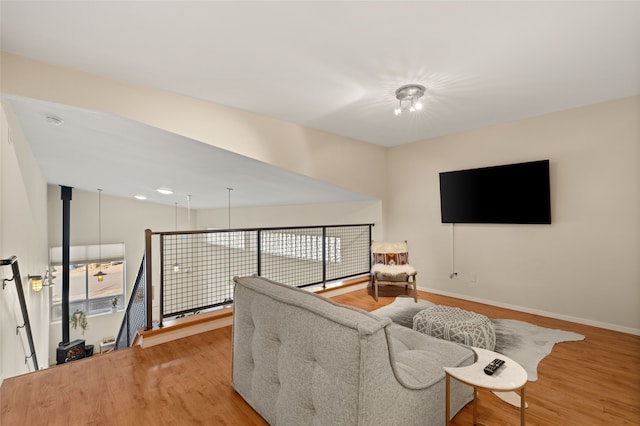 living area with light wood finished floors and baseboards