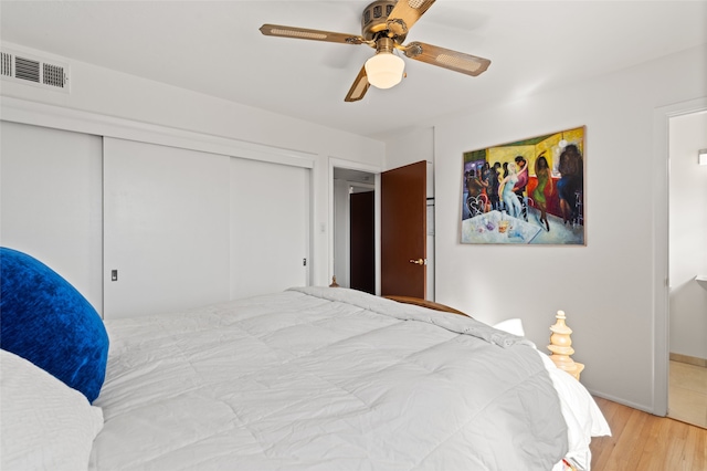 1115 N Luna Cir, Santa Fe, NM 87501 - bedroom featuring wood finished floors, a closet, ceiling fan, and baseboards