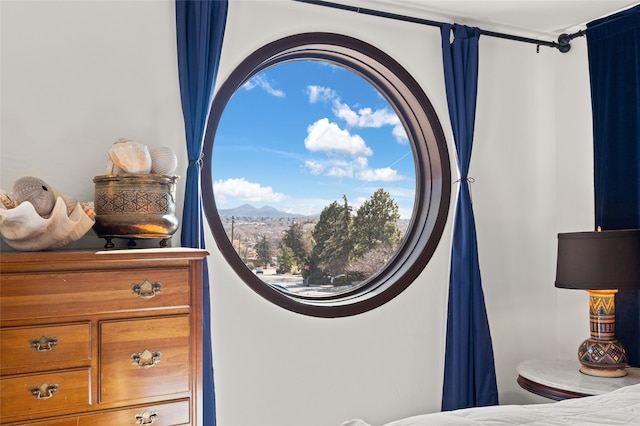 1115 N Luna Cir, Santa Fe, NM 87501 - bedroom featuring a mountain view and multiple windows