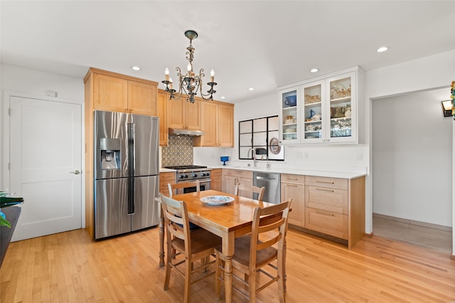 1115 N Luna Cir, Santa Fe, NM 87501 - kitchen featuring stainless steel appliances, under cabinet range hood, recessed lighting, a chandelier, and light brown cabinets