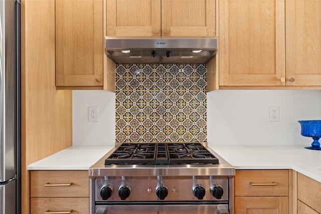 1115 N Luna Cir, Santa Fe, NM 87501 - kitchen with stainless steel appliances, ventilation hood, light countertops, and decorative backsplash