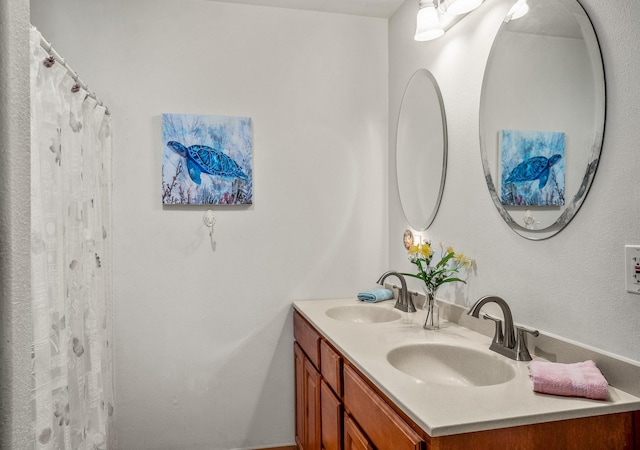 full bath featuring double vanity and a sink