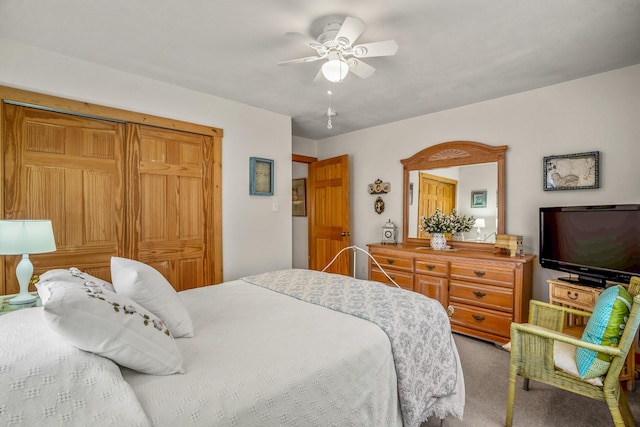 bedroom featuring a ceiling fan and carpet