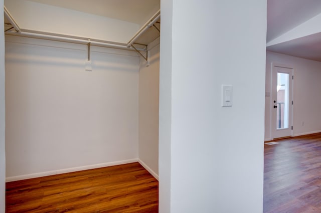 walk in closet with visible vents and wood finished floors