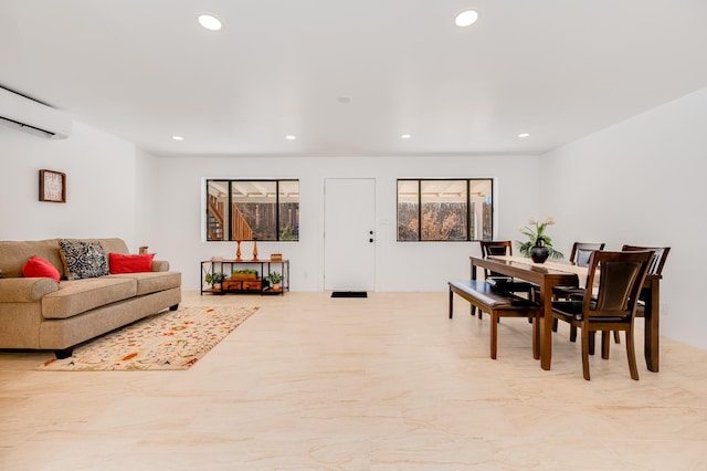 interior space with a wall mounted air conditioner and recessed lighting