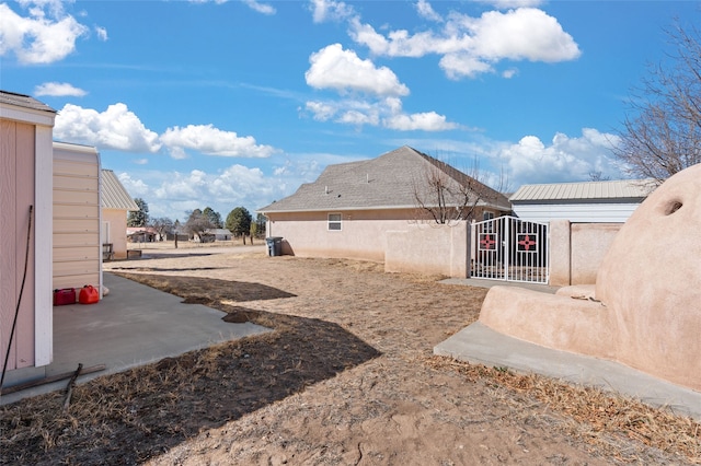 view of yard featuring a gate and fence