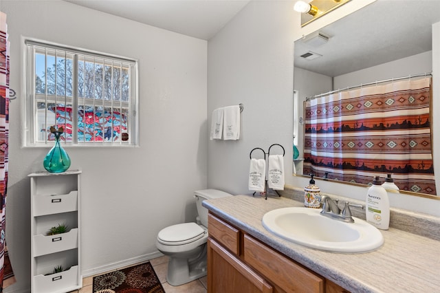 bathroom featuring toilet, a shower with shower curtain, visible vents, vanity, and tile patterned floors