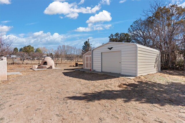 view of shed featuring driveway