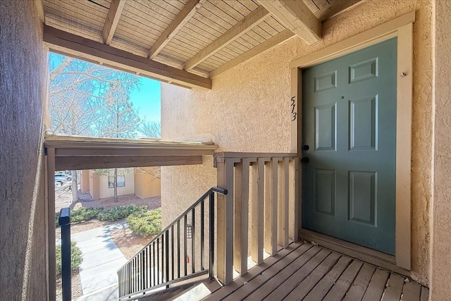 entrance to property with stucco siding