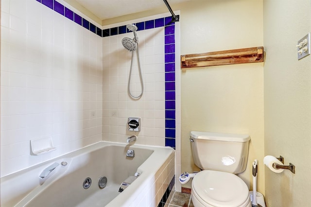 bathroom featuring toilet and shower / tub combination