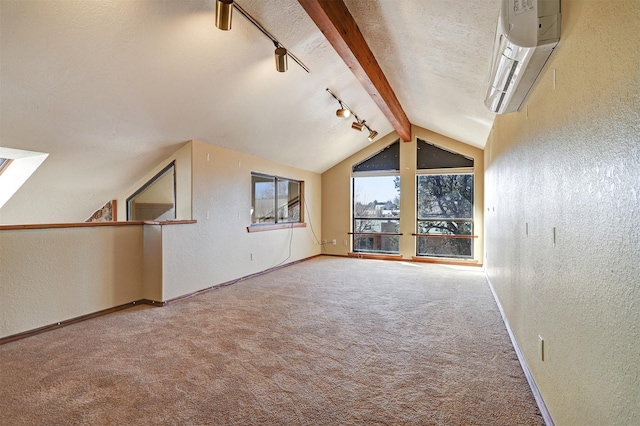 additional living space featuring vaulted ceiling with beams, a textured wall, carpet flooring, a textured ceiling, and a wall mounted air conditioner