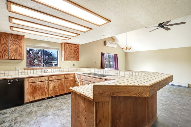 kitchen featuring a wall unit AC, a peninsula, a sink, tile counters, and black appliances