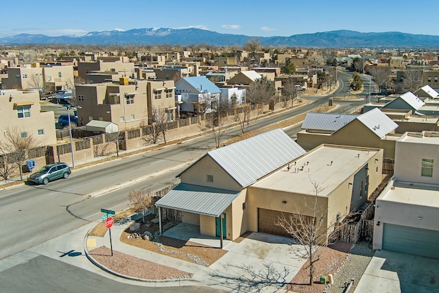 birds eye view of property with a residential view and a mountain view