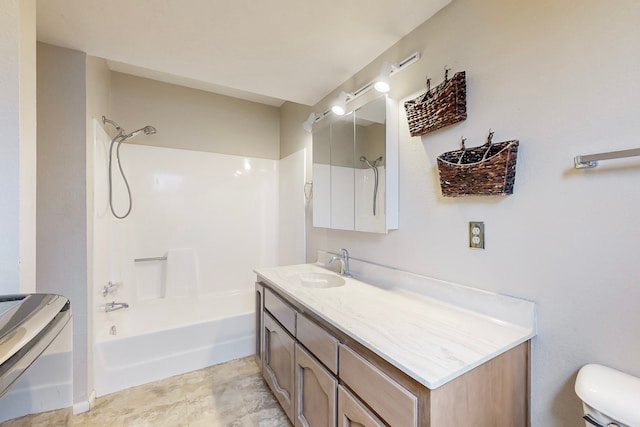 full bath with bathtub / shower combination, washer / dryer, vanity, and toilet