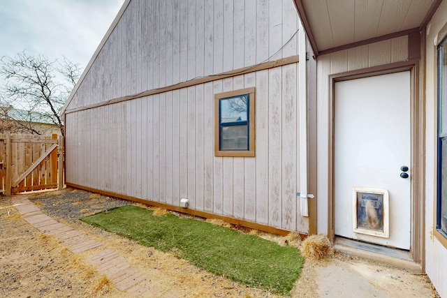 view of property exterior featuring fence