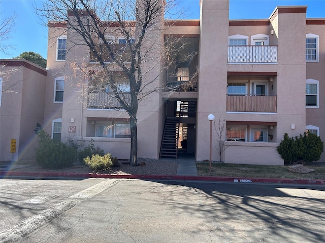 view of property featuring stairs