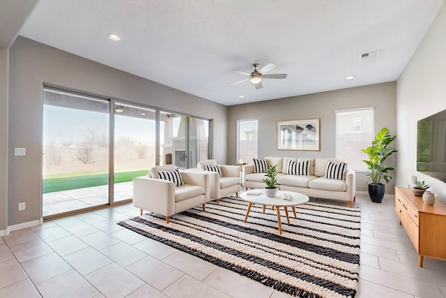 living area featuring a ceiling fan, recessed lighting, visible vents, and light tile patterned floors