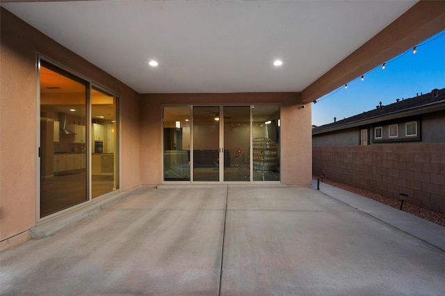 view of patio / terrace featuring fence