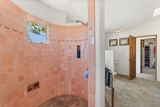 full bathroom featuring tiled shower