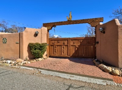 view of gate with fence