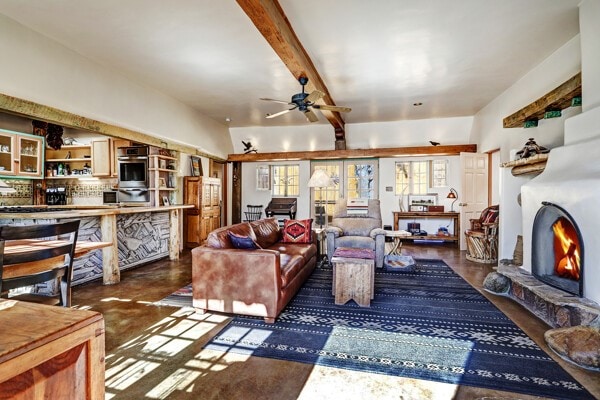 220 Irvine Unit B, Santa Fe, NM 87501 - living room featuring ceiling fan, beam ceiling, and concrete flooring