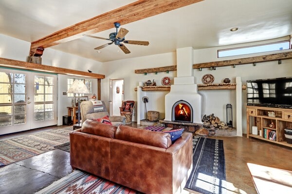 220 Irvine Unit B, Santa Fe, NM 87501 - living room featuring healthy amount of natural light, ceiling fan, and beamed ceiling