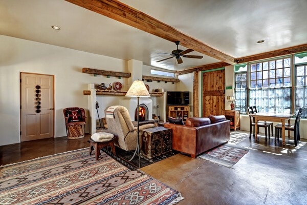 220 Irvine Unit B, Santa Fe, NM 87501 - living area with finished concrete flooring, ceiling fan, and beamed ceiling