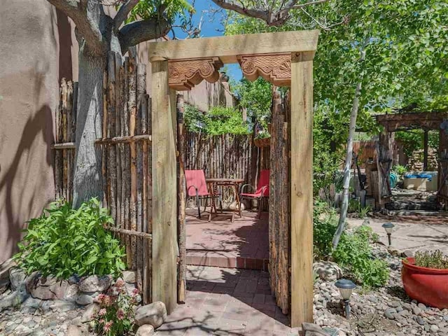 view of patio with fence and a pergola