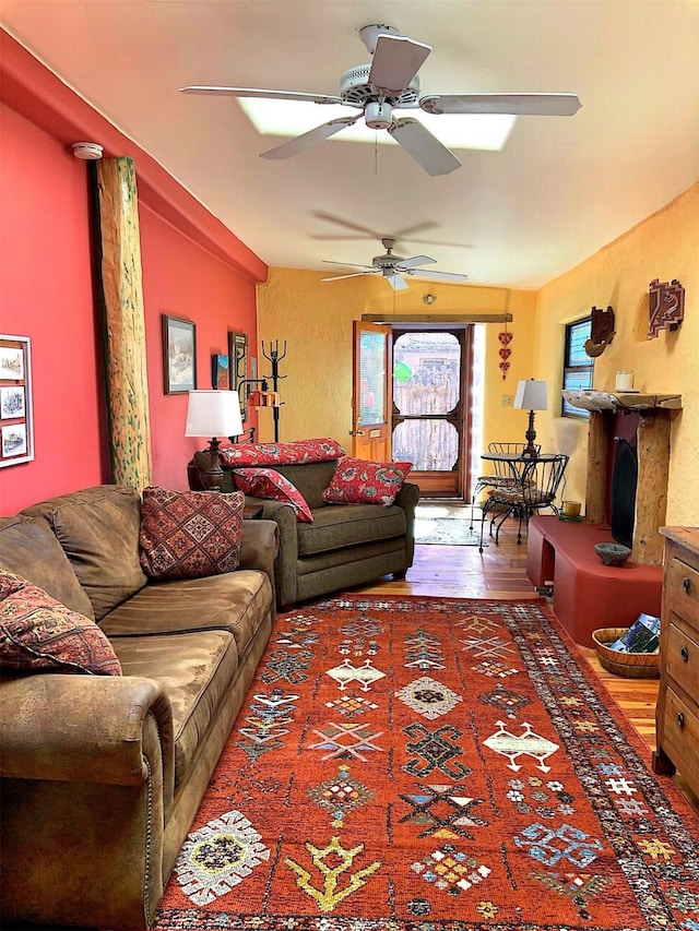 living room with wood finished floors and a textured wall