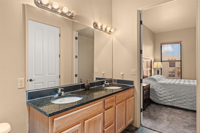 ensuite bathroom with double vanity, a sink, and ensuite bathroom