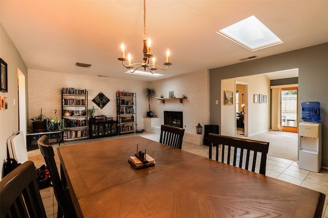 dining area featuring light tile patterned floors, brick wall, a fireplace, and visible vents